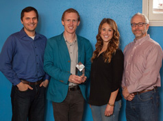 BrandHoot team holding their award