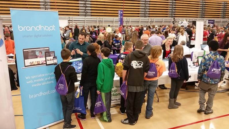 Middle Schoolers visiting booth at STEM Summit